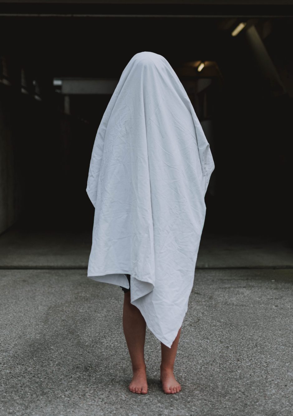 Person covered with a white sheet